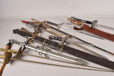 Lot 1031 - A collection of decorative wall hanger swords and weaponry