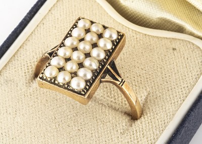 Lot 114 - A seed pearl and yellow metal dress ring