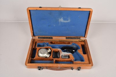 Lot 1049 - A fitted case for a pistol