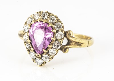 Lot 116 - An 18ct yellow gold pink pear cut sapphire and diamond cluster ring