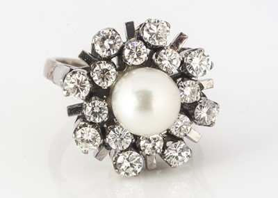 Lot 128 - An 18ct white gold diamond and cultured pearl dress ring