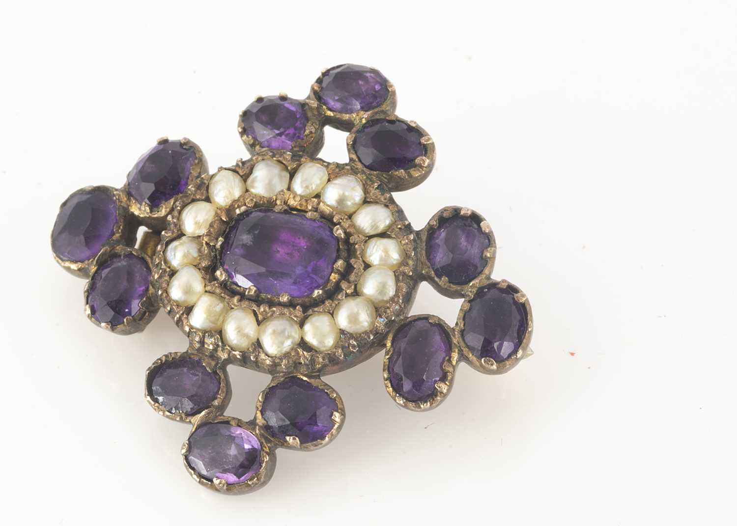 Lot 133 - A 19th Century amethyst and seed pearl cruciform brooch