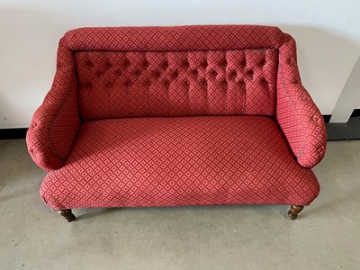 Lot 368 - A two seater red fabric upholstered sofa