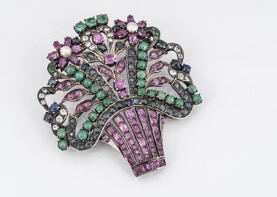Lot 31 - An Indian white metal and multi gem set floral brooch