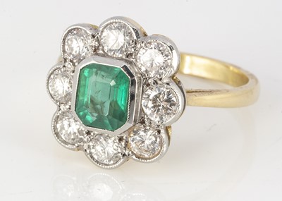 Lot 175 - An 18ct yellow gold emerald and diamond cluster ring