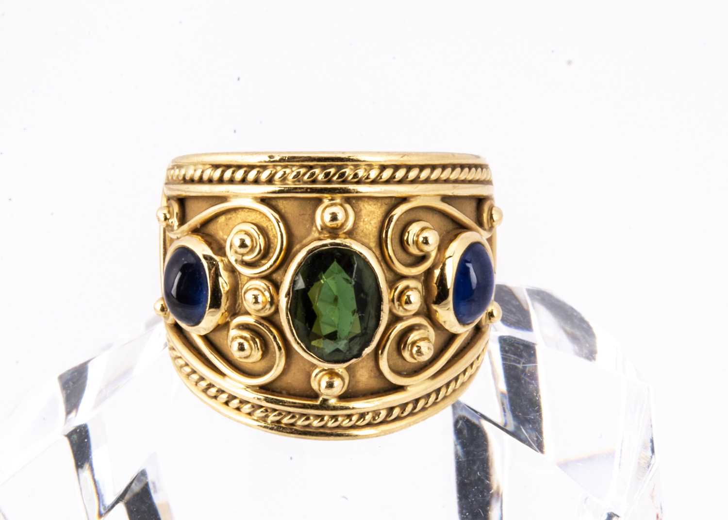 Lot 47 - A continental 18ct gold tourmaline and sapphire dress ring