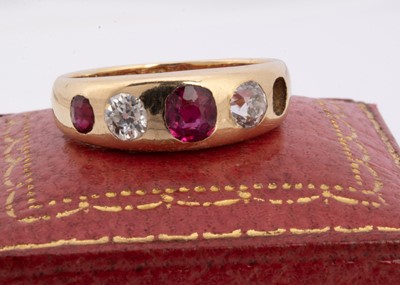 Lot 61 - A five stone ruby and diamond dress ring