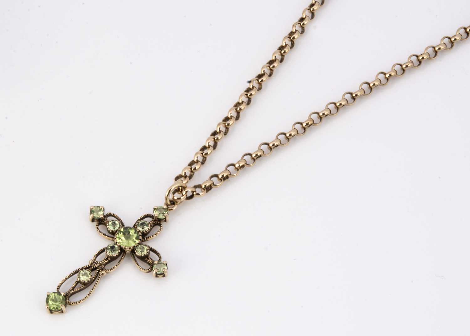 Lot 63 - A 9ct gold peridot openwork cross