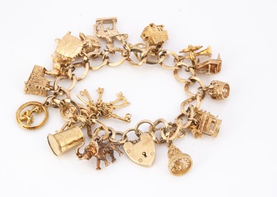 Lot 90 - A 9ct gold charm bracelet
