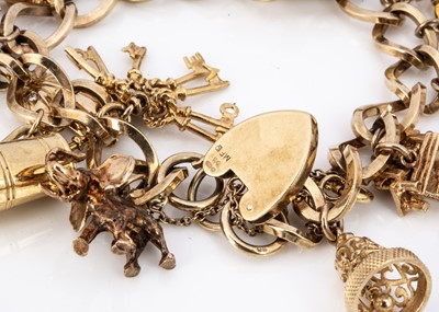 Lot 90 - A 9ct gold charm bracelet