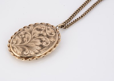 Lot 94 - A 9ct gold oval engraved locket