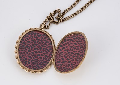 Lot 94 - A 9ct gold oval engraved locket