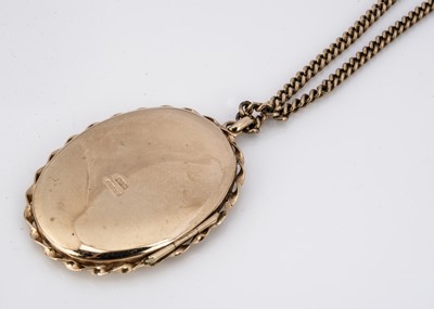 Lot 94 - A 9ct gold oval engraved locket