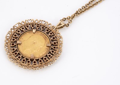 Lot 95 - A full Sovereign garnet and gold mounted pendant