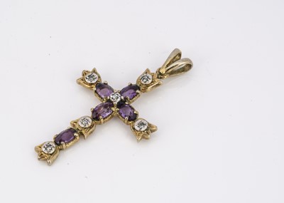 Lot 96 - A silver gilt amethyst and diamond cross pendant