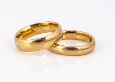 Lot 120 - Two 22ct gold barrel shape wedding bands