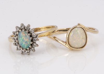 Lot 128 - Two opal dress rings