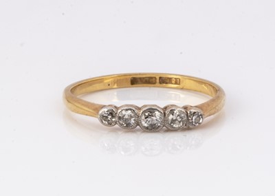 Lot 138 - An Edwardian 18ct gold and platinum five stone diamond dress ring