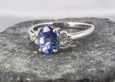 Lot 154 - A 9ct white gold tanzanite and zircon dress ring