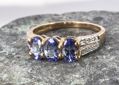 Lot 155 - A 9ct gold tanzanite and white diamond dress ring