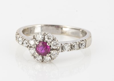 Lot 187 - A ruby and diamond cluster ring