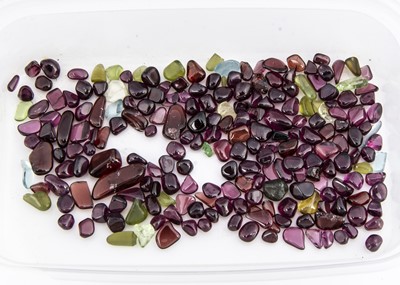 Lot 179 - A collection of polished garnet, quartz loose gems