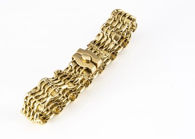Lot 188 - An 18ct gold wave and baton textured bracelet