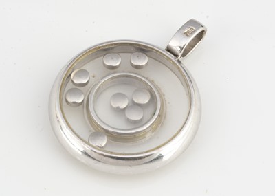 Lot 184 - A continental white gold 750 double diamond set bezel circular pendant