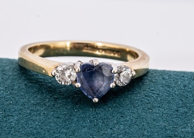 Lot 202 - An 18ct gold sapphire and diamond three stone ring