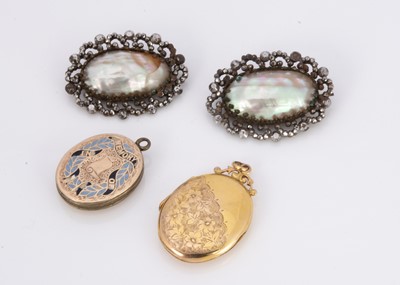 Lot 226 - A pair of 19th century mother of pearl and base metal oval brooches