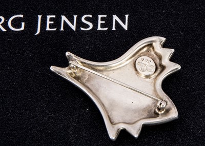 Lot 275 - Henning Koppel for Georg Jensen blue 306 stylised fish silver brooch
