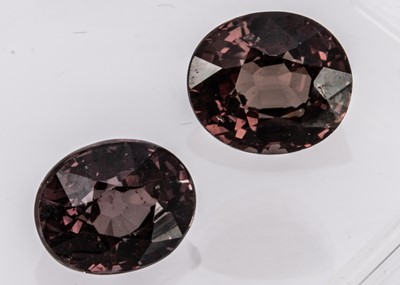 Lot 303 - A certificated oval cut Garnet