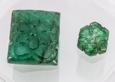 Lot 335 - Two certificated carved Zambian Emeralds