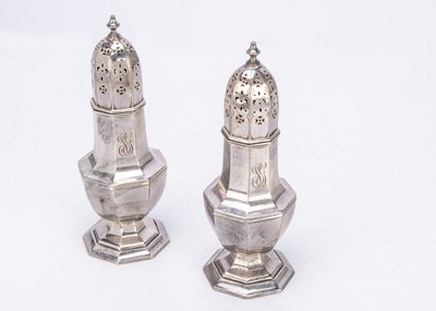 Lot 395 - A large pair of George V silver sugar sifters