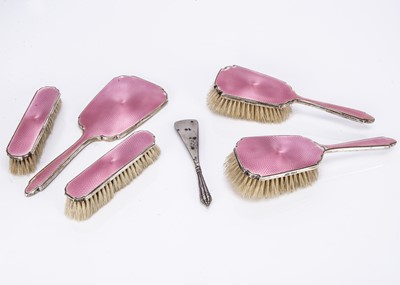 Lot 411 - A part Art Deco period silver and pink enamelled dressing table set