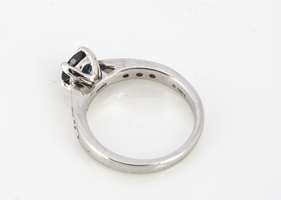 Lot 211 - A contemporary sapphire and diamond dress ring