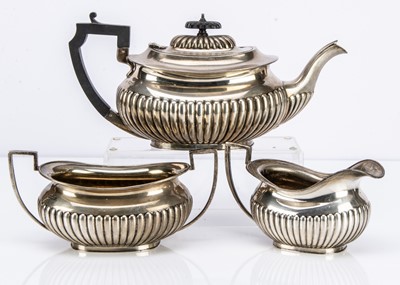 Lot 454 - A George V silver three piece tea set by John Round & Son Ltd