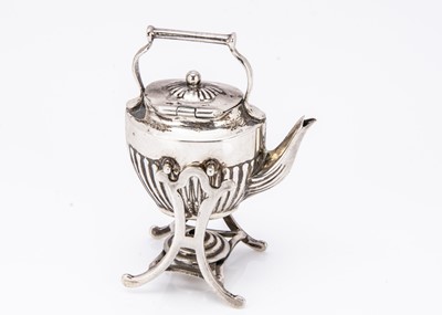 Lot 495 - A miniature silver kettle on stand