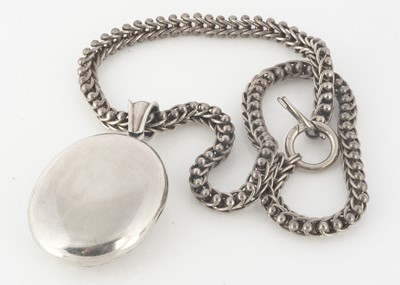 Lot 221 - A Victorian silver embossed oval locket