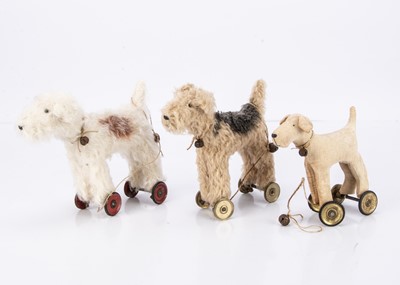 Lot 81 - Three unknown artist dogs on wheels
