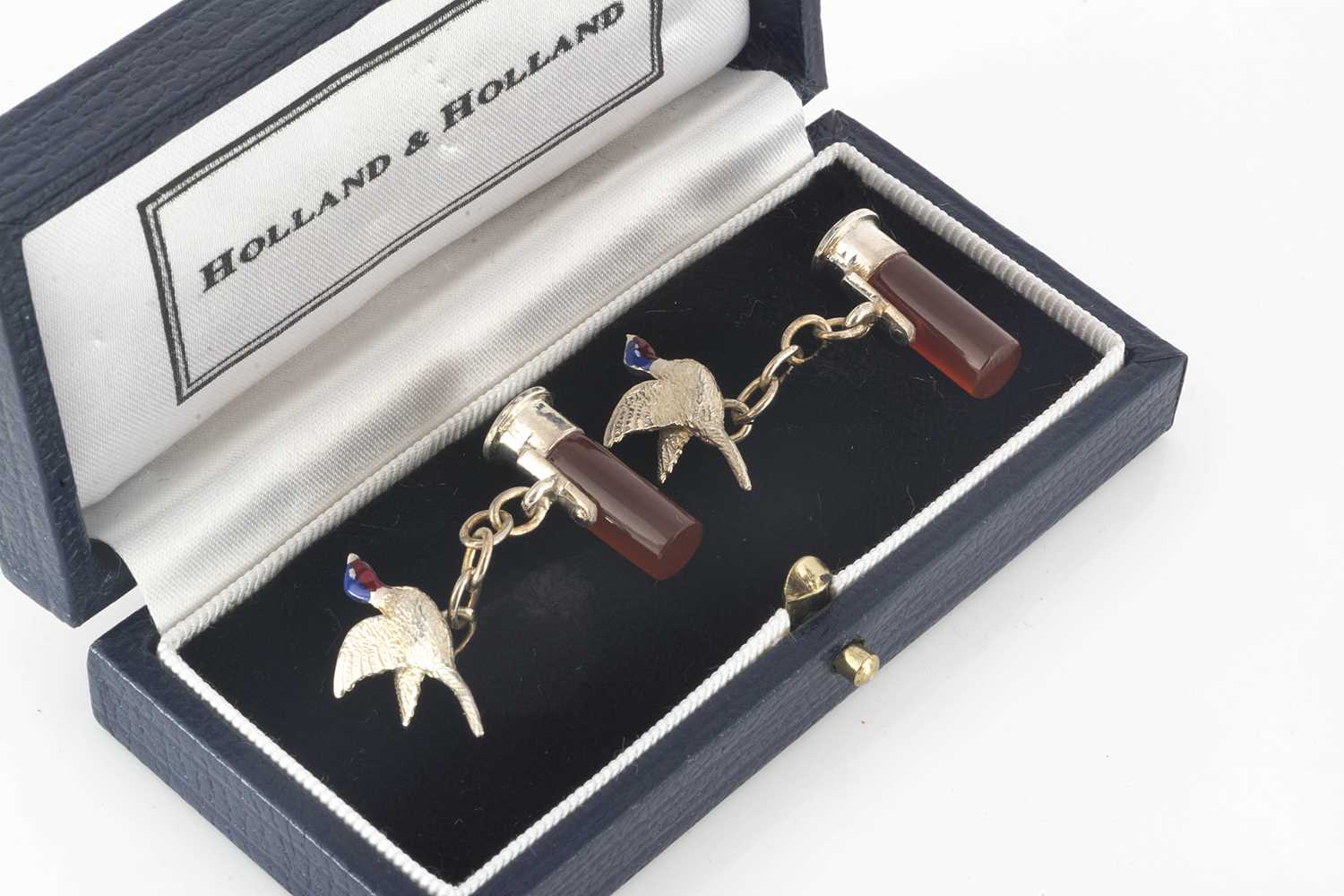 Lot 225 - A pair of Holland and Holland silver and agate cufflinks