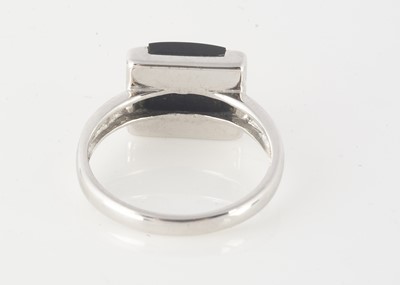 Lot 228 - A 9ct white gold onyx and diamond dress ring