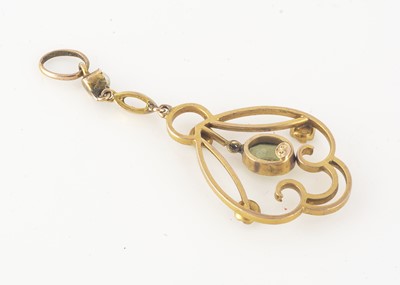 Lot 235 - An Edwardian gold, peridot and seed pearl openwork drop pendant