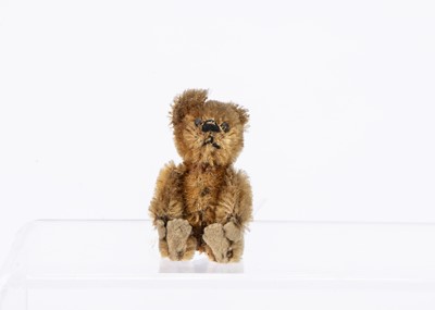 Lot 229 - A 1930s Schuco miniature golden mohair teddy bear