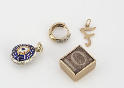 Lot 240 - A 14ct gold and enamel decorated egg charm