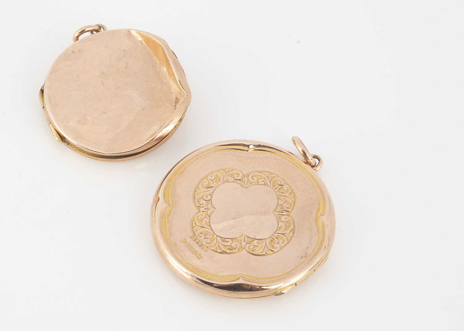 Click H Locket Lot 241 - A 9ct gold circular locket,