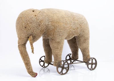 Lot 397 - A 1910-20s grey mohair Elephant on wheels