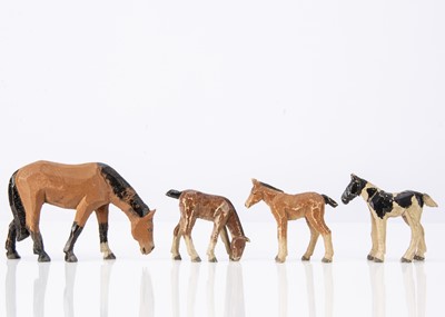 Lot 417 - A Forest Toys of Brockenhurst New Forest pony and three foals