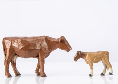 Lot 419 - A Forest Toys of Brockenhurst cow and calf