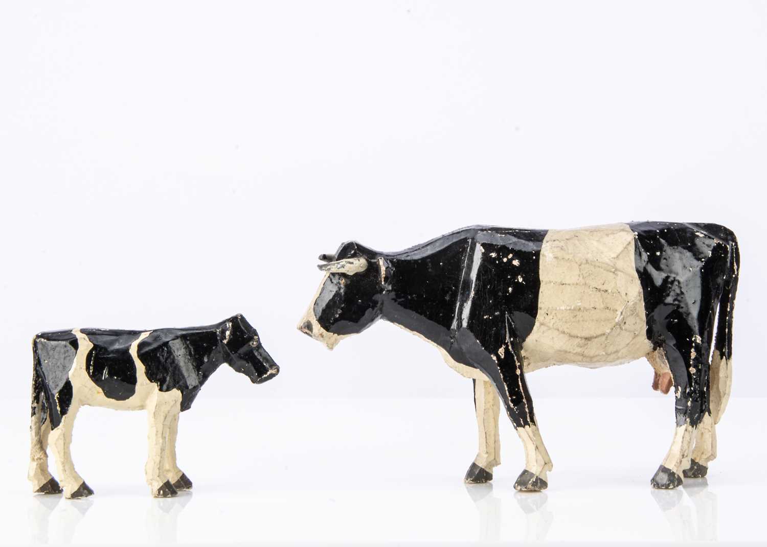 Lot 420 - A Forest Toys of Brockenhurst cow and calf